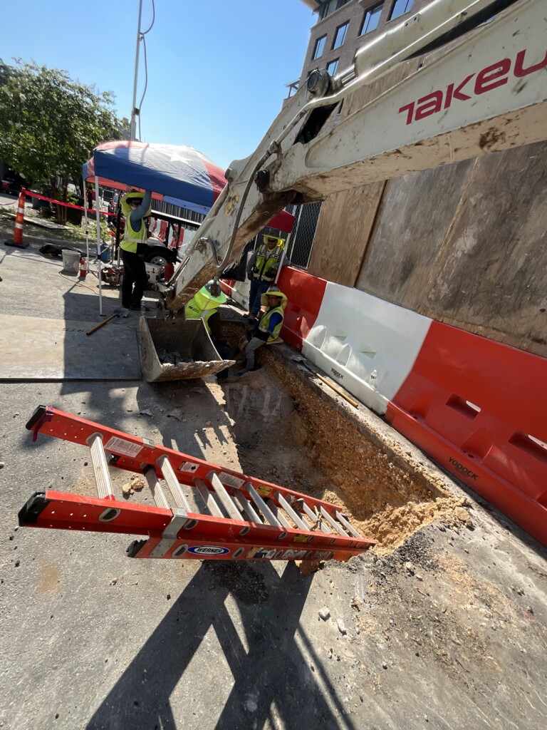 Underground utility work on 20th Street alley entrance, August 22, 2024